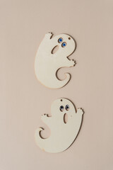laser cut plywood ghost shapes on paper