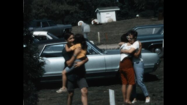 Family Hugs 1966 - A family hugs during a surprise visit to the summer camp  