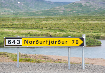 Sign near the road pointing towards village of Nordurfjordur in Icleand