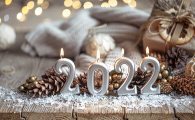 Festive New Year background with candles in the form of the numbers 2022.