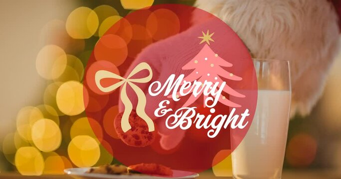 Animation of mery and bright christmas text over candies on wooden background
