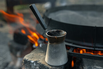 Close-up of a Turk with coffee on a blurred background.