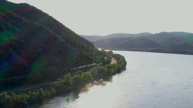 Drone shot train on the rivers edge in the Hernad Valley in Hungary near the Boldogko Castle
