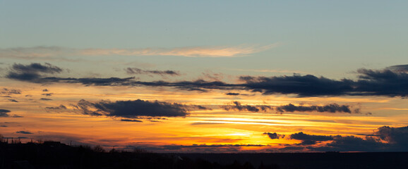 The evening sunset. Panorama. Majestic Storm Clouds. Tragic gloomy sky.