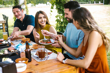 Group of latin friends eating mexican food in the restaurant terrace in Mexico Latin America	