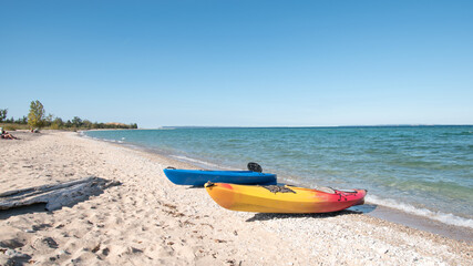Kayaks on the beach at Sleeping Bear Bay, Michigan.