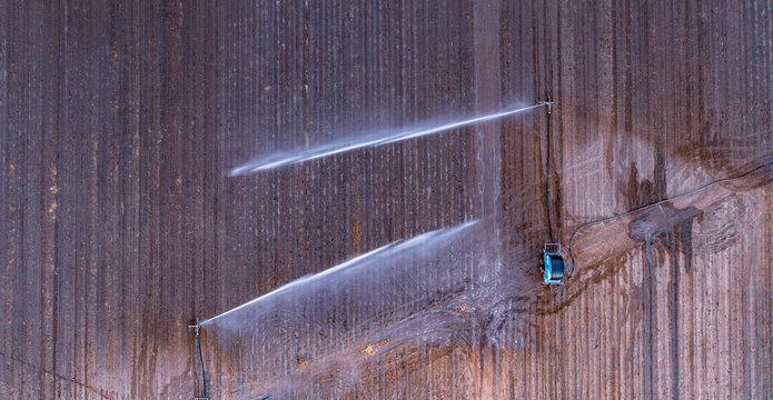 Water sprinklers on a ploughed field near Gin Gin, Queensland From Above