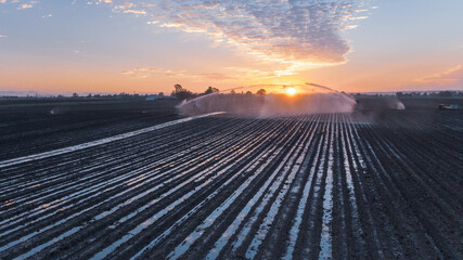 Water sprinklers on a ploughed field near Gin Gin, Queensland