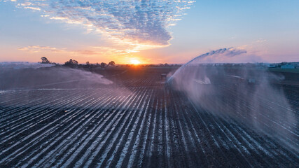 Water sprinklers on a ploughed field near Gin Gin, Queensland