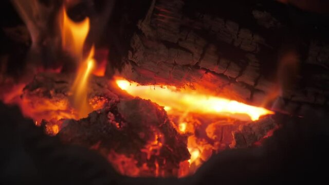 burning firewood in a fireplace slow motion