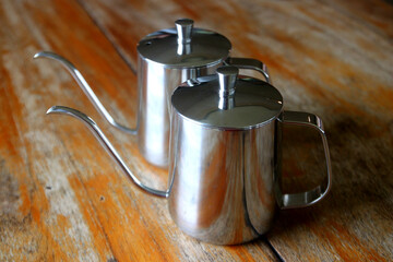 coffee drip kettle jug on wooden table