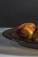 Fried dumplings with cheese, selective focus, copy space and black background