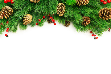 Christmas and New Year background with green spruce branches, cones and red berries, white banner, top view, copy space