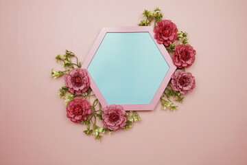 Blue Hexagon background and pink border decorate with flowers on pink background