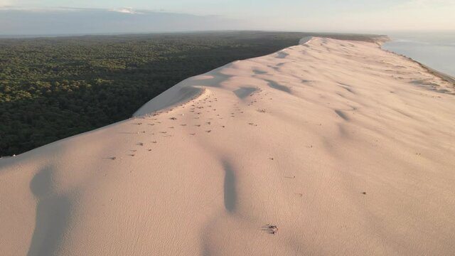 Dune of Pilat and forest in background, Arcachon basin in France. Aerial panoramic circling view