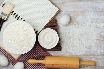 Homemade flour mixture on a wooden table, viewed from above.
