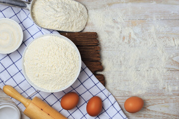 Homemade flour mixture on a wooden table, viewed from above.