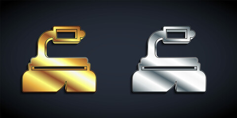 Gold and silver Brush for cleaning icon isolated on black background. Cleaning service concept. Long shadow style. Vector