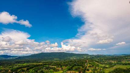 Beautiful landscape mountain green field grass meadow white cloud blue sky on sunny day. Majestic green scenery big mountain hill cloudscape valley panorama view in countryside greenery pasture