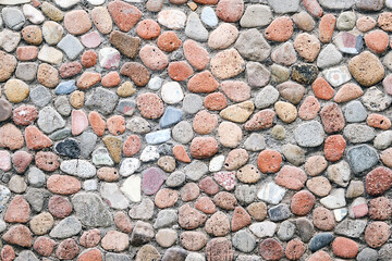 Background from a wall made of pebbles