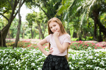 Fototapeta premium Smiling pretty little girl in spring day
