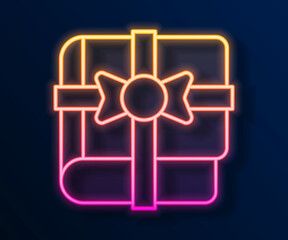 Glowing neon line Book as a gift icon isolated on black background. Vector