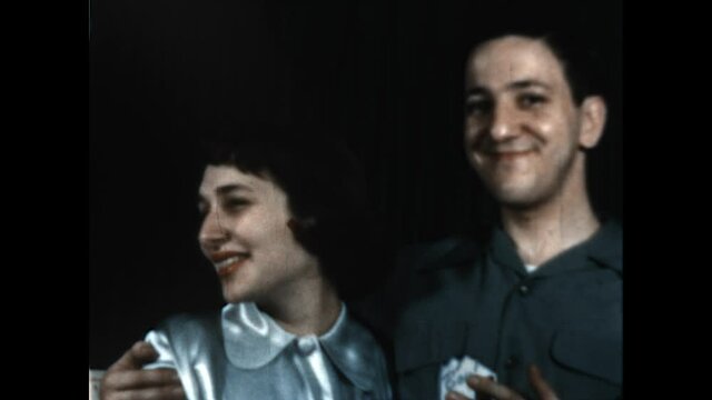 Smoky Kiss 1951 - A man smokes a cigar and kisses his wife.  