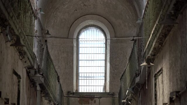 Barred window in 19th century penitentiary.
