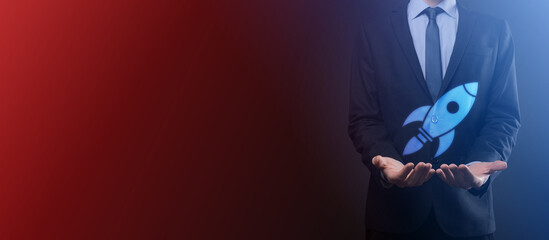 An empty workpiece. A businessman in a suit on a black background holds his hands protective gesture. A gesture of care and patronage.