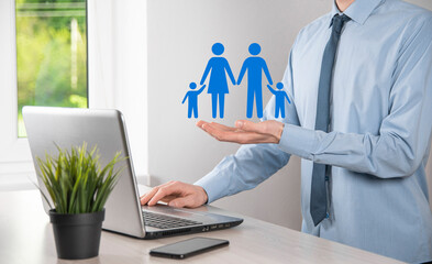Hand hold young family icon. Family life insurance,supporting and services,family policy and supporting families concepts.Happy family concept.Copy space.mancupped hands showing paper man family
