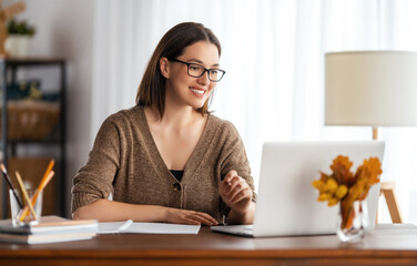 young woman working at home