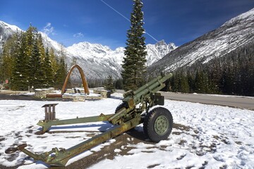 Rogers Pass Monument Artillery Canon used to Control Avalanches with Snowy British Columbia, Canada...