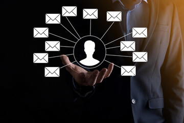 Male hand holding letter icon,email icons .Contact us by newsletter email and protect your personal information from spam mail. Customer service call center contact us.Email marketing and newsletter