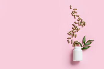 Bottle with vitamin K pills on color background