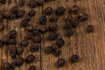 black pepper on wooden table