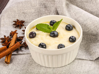 Tasty dairy porrige with berries