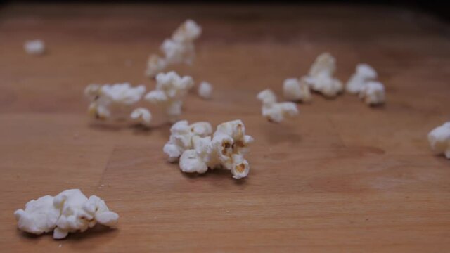 popcorn falling on table slow motion 