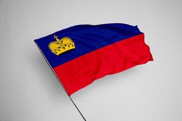 Liechtenstein flag isolated on white background. close up waving flag of Liechtenstein. flag symbols of Liechtenstein. Concept of Liechtenstein.