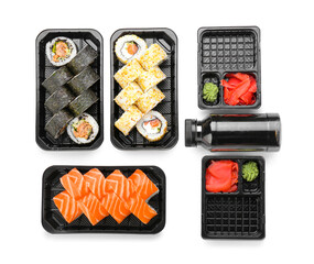 Composition with delicious sushi rolls on white background