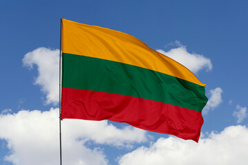 Lithuania flag isolated on the blue sky background. close up waving flag of Lithuania. flag symbols of Lithuania. Concept of Lithuania.