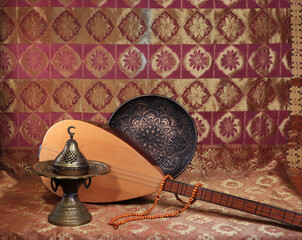 Traditional Turkish lamps, incense burner, rosary beads, national musical instrument baglama saz. symbol of Islam. still life