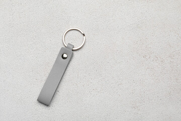 Leather keychain on light background