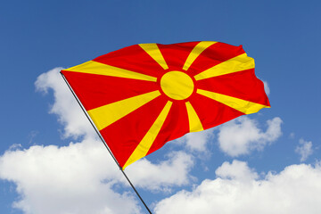 Macedonia flag isolated on the blue sky background. close up waving flag of Macedonia. flag symbols of Macedonia. Concept of Macedonia.