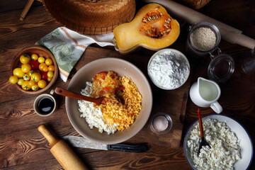 Chopped tomatoes, pumpkin and cottage cheese in a ceramic bowl