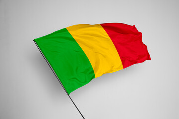 Mali flag isolated on white background. close up waving flag of Mali. flag symbols of Mali. Concept of Mali.