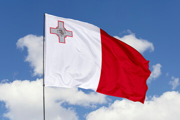 Malta flag isolated on the blue sky background. close up waving flag of Malta. flag symbols of Malta. Concept of Malta.