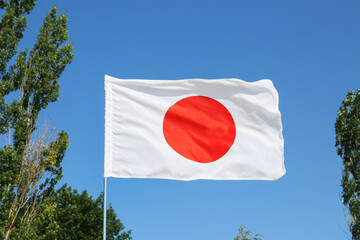 Waving flag of Japan outdoors