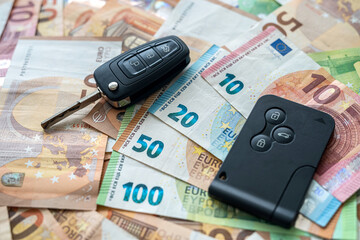 euro bills and a car key. auto investment insurance