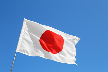 Waving flag of Japan outdoors