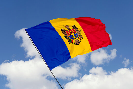 Moldova flag isolated on the blue sky background. close up waving flag of Moldova. flag symbols of Moldova. Concept of Moldova.